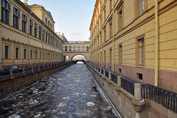 Fototapeta na wymiar View of the winter canal connecting the Moika river with the Neva. Saint Petersburg, Russia
