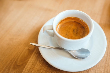 Coffee on a wooden cafe table