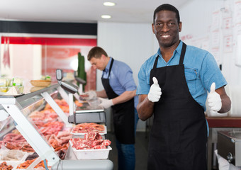 Satisfied African American butcher