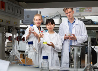 Fototapeta na wymiar Multiracial team of chemists in laboratory