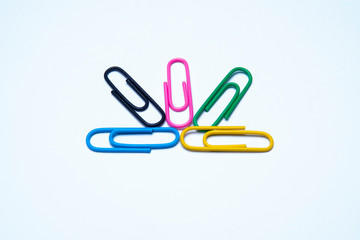 colorful paper clips isolated on white background
