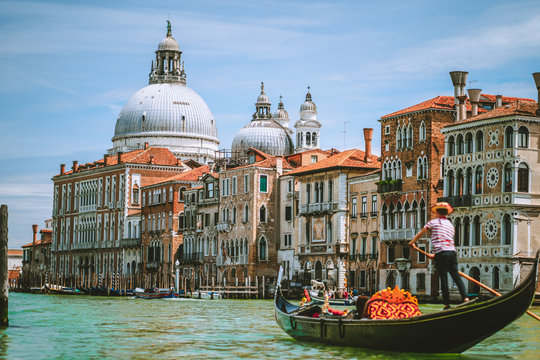 Grand Canal, Traditional Gondola and Basilica Santa Maria della Salute in background, Venice, Italy