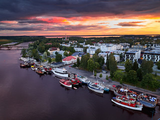 Aerial view of retro steamships at the pier on the Pielisjoki river in Joensuu, Finland. On the sky...
