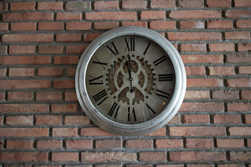 clock on a brick wall