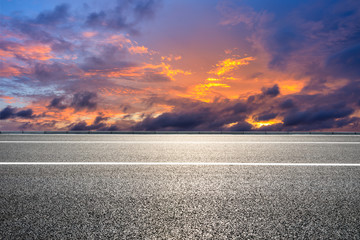 Empty asphalt road and sunset sky landscape in summer