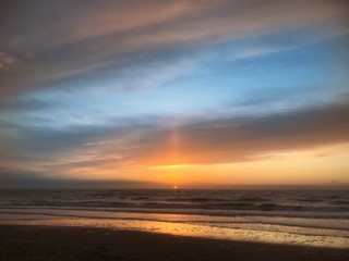 Fototapeta na wymiar Sunset at the beach Julianadorp Netherlands. Coast Northsea. 