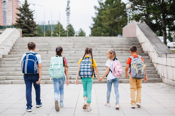 Teenagers with backpacks.