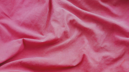 pink cotton fabric background. red silk cloth