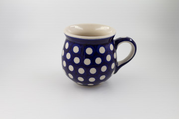 blue cup with white polka dots
