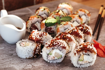 Sushi set with home delivery. Romantic dinner. Sushi in box.