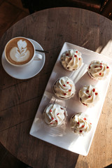 Cupcakes with hearts, coffee shop, romantic meeting for St. Valentine.