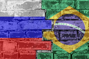 Russia Federation and Brasil - National flags on Brick wall. Governments relations and conflict concept.