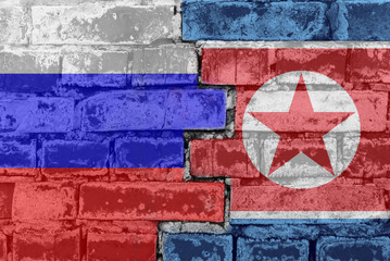 Russia Federation and North Korea - National flags on Brick wall. Governments relations and conflict concept.