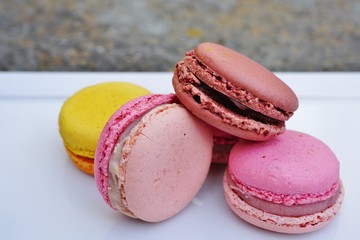 Colorful round macaron cookies on a platter