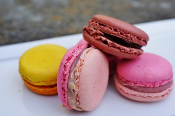 Colorful round macaron cookies on a platter