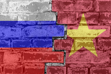 Russia Federation and Vietnam - National flags on Brick wall. Governments relations and conflict...