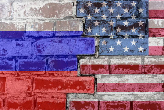 Russia Federation and United States of America- National flags on Brick wall. Governments relations and conflict concept.