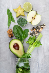 Fresh green vegetables and smoothie jar mugs.
