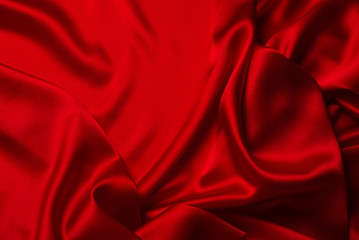 Red silk or satin luxury fabric texture can use as abstract background.