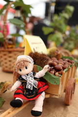 Doll wearing traditional costume of Asturias and chestnuts - 322082818