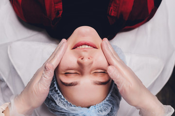 The doctor cosmetologist makes the biorepil facial injections procedure for tightening and...