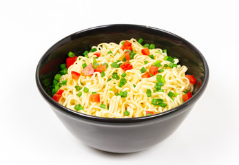 Instant noodles in black ceramic bowl isolated on white background.