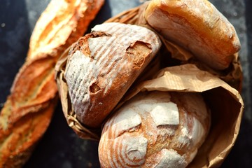 Crispy bread on a dark background, top view. A variety of bread, place for text.