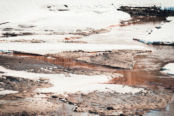 Melting white snow from the warmth of spring days.