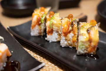 Close up sushi roll with eel and avocado