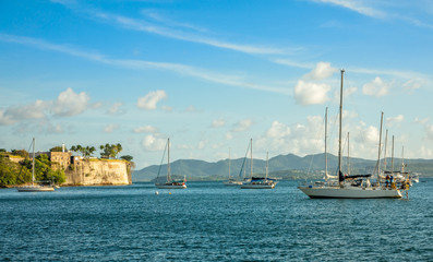 Fototapeta na wymiar Yachts anchored in Fort De France harbor with fortress in the background, Fort-De-France, Martinique, French overseas department