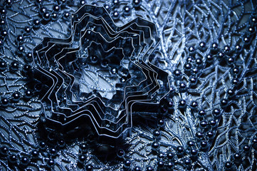 Metal molds for biscuits of various shapes on a gray background with New Year's garland