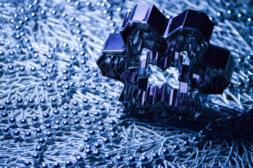 Metal molds for biscuits of various shapes on a gray background with New Year's garland