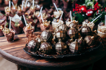 Christmas garland with decoration on wooden background.