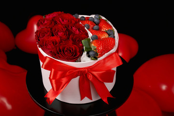 Bouquet of roses, strawberries and blueberries. Gift for Valentine's Day. Wedding bouquet in a box