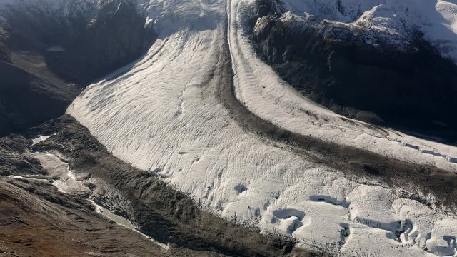 Slowly rotating aerial view of the majestic gorner glacier in Switzerland