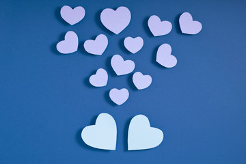 Valentine hearts on blue surface. Top view, flat lay, from above, copy space