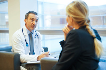 Fototapeta premium Specialist with patient in doctor's office