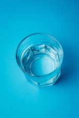 glass of water on a blue background