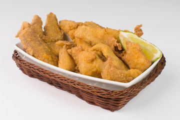 Fried Tilapia strips in platter  isolated in white background