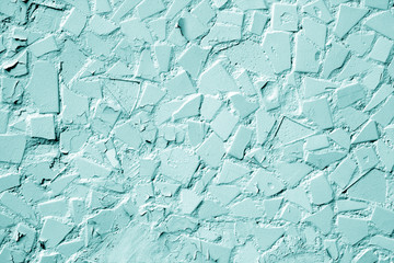 Wall of house with cement and paint in cyan tone.