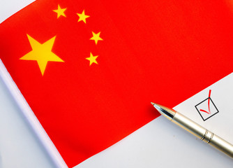 Pencil, Flag of China and check mark on paper sheet