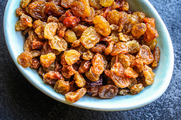 raisins, delicious dried grapes (fresh fruit vitamins) menu concept background. top view. copy space