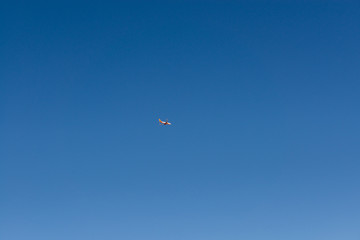 Airplane in clear blue sky
