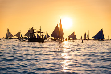 Paraw sailing at Boracay Island, Philippines at Sunset