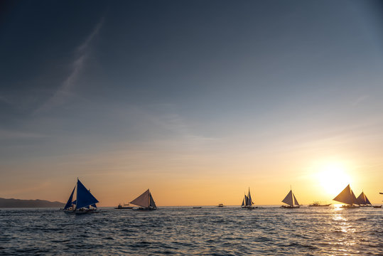 Paraw sailing at Boracay Island, Philippines at Sunset