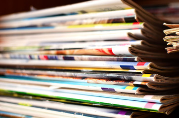 Extensive collection with a lot of glossy multi-colored magazines. Periodicals, official publication journalism concept, receiving news and latest information, background, texture