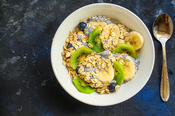 healthy food smoothie bowl, oatmeal, chia seeds and berries (breakfast dish or healthy snack) menu concept. background. top view. copy space
