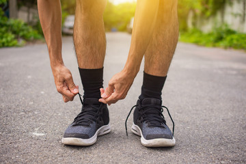 Close up man Tied shoes for Running