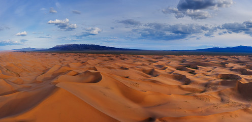 Sand dunes in Gobi Desert at sunset