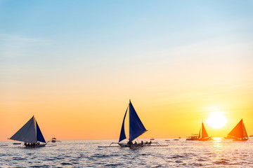 Paraw sailing at Boracay Island, Philippines at Sunset